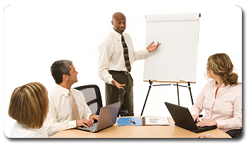 A man giving a presentation to a group of businesspeople
